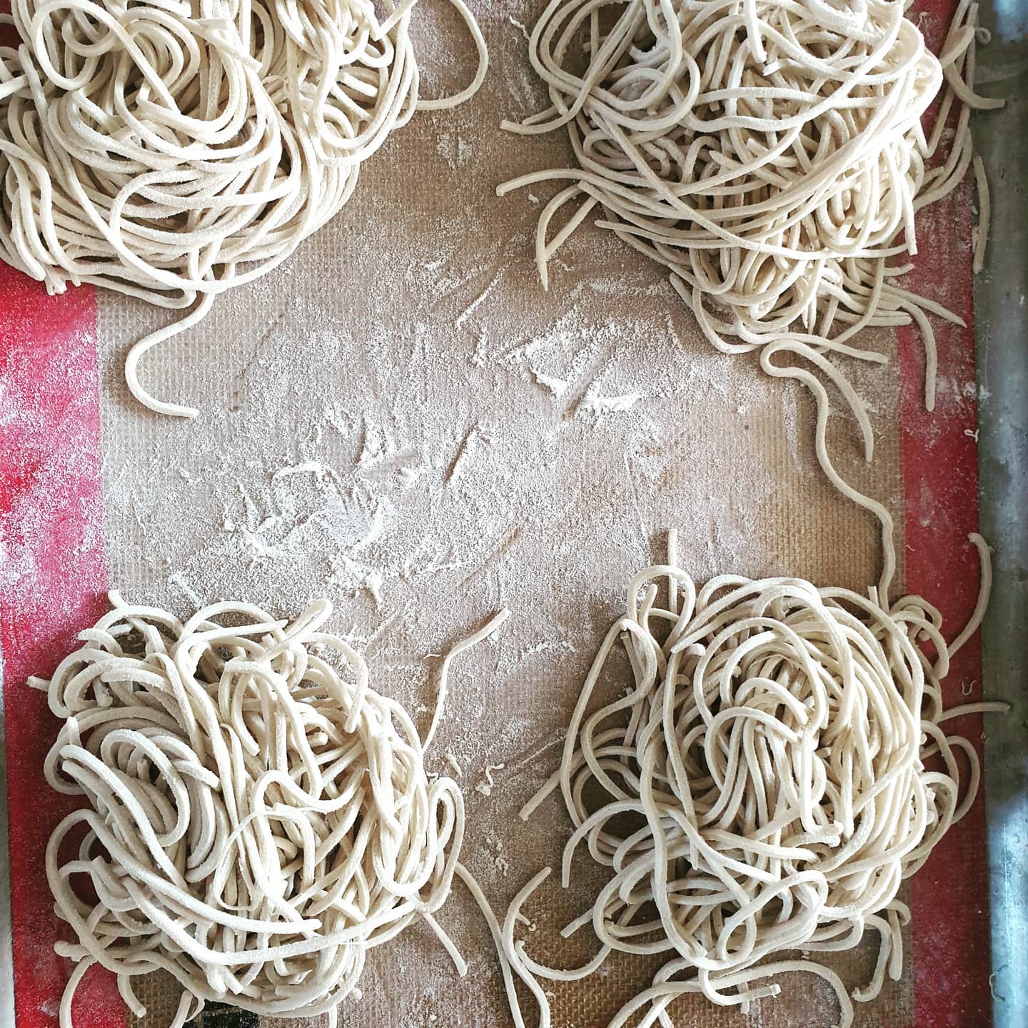 Ramen noodles. 100% wheat flour, 45% water, 3% baked baking soda. About 80-100g per portion in a soup. Bake baking soda in oven at 120C for an hour. This will help with the texture and colour the noodle yellow.